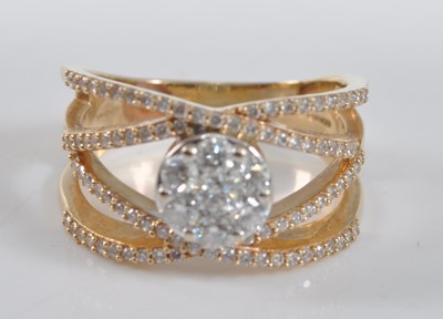 Lot 1189 - A yellow metal four-strand diamond crossover...