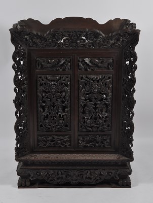 Lot 1282 - An early 20th century Chinese heavily carved...