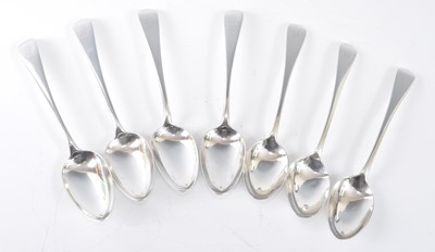 Lot 1069 - A matched set of seven George III silver...