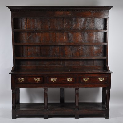 Lot 1446 - A George III joined oak dresser, having...