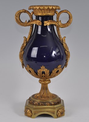 Lot 1237 - A mid-19th century gilt metal and porcelain...