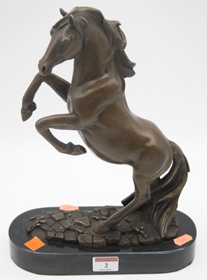 Lot 2 - A reproduction bronzed figure of a rearing...