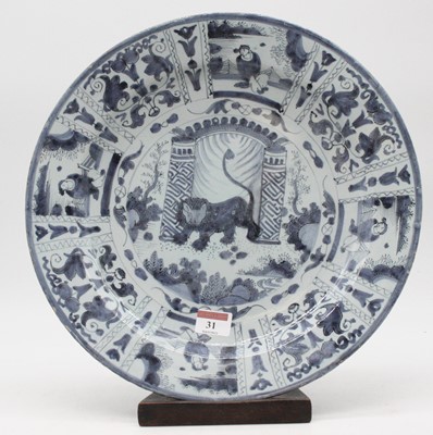 Lot 31 - An 18th century Delft charger underglaze blue...