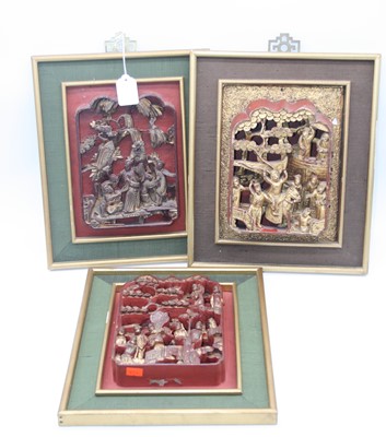 Lot 63 - A Chinese panel, the shaped lacquered centre...