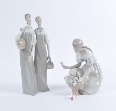 Lot 2 - A Lladro porcelain figure group of two women,...