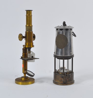 Lot 25 - An early 20th century brass monocular...