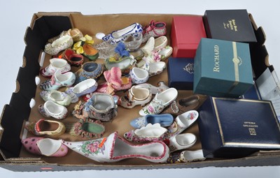Lot 71 - A box of miniature shoes, to include porcelain...