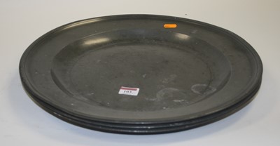 Lot 103 - A set of three 19th century pewter chargers,...