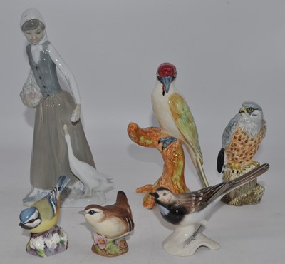 Lot 225 - A Nao porcelain figure of a girl, h.24cm;...