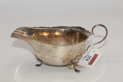 Lot 254 - A George V silver helmet shaped sauceboat,...