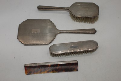 Lot 271 - An Elizabeth II silver four-piece dressing...
