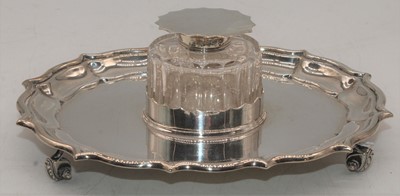 Lot 274 - An Edward VII silver inkwell on stand, having...