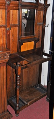 Lot 1144 - An Edwardian walnut mirrorback hall stand,...