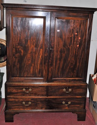 Lot 1160 - An early 19th century mahogany linen cabinet,...