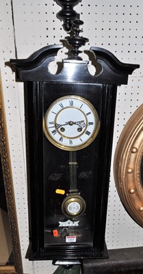 Lot 1163 - An early 20th century ebonised drop trunk wall...