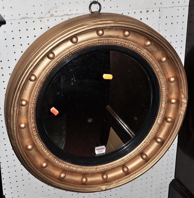 Lot 1165 - A Regency style gilt decorated circular convex...