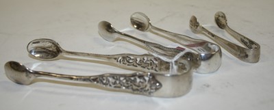 Lot 310 - A pair of Edward VII silver sugar nips,...