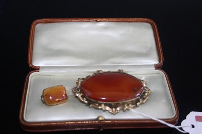 Lot 407 - A Victorian gilt metal and hardstone set oval...