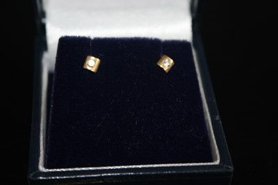 Lot 412 - A pair of 14ct yellow gold diamond set ear...