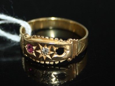 Lot 416 - A yellow metal, ruby and diamond dress ring,...