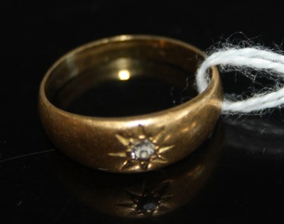 Lot 427 - An 18ct gold diamond 'gypsy' ring, the single...