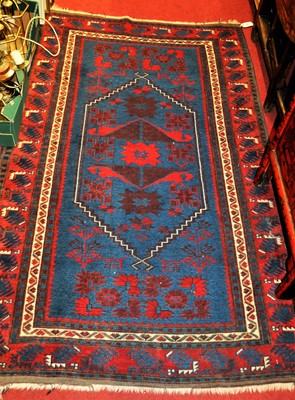 Lot 1199 - A Persian woollen Shiraz blue ground rug, 195...