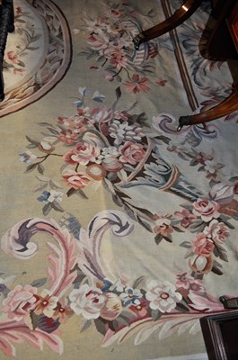 Lot 1200 - A large machine-made cream ground floral...