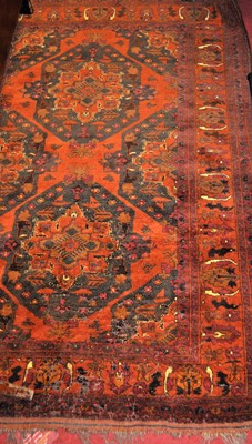 Lot 1203 - A Persian rust ground woollen Tabriz rug, 180...
