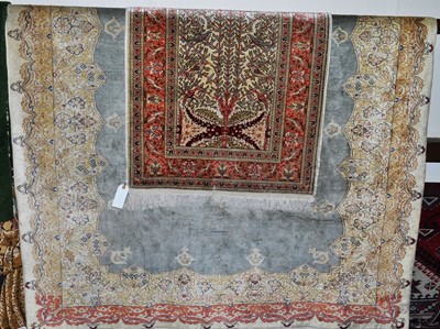 Lot 1208 - An Indian cream ground floral decorated rug,...