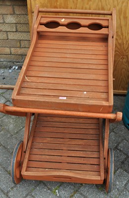 Lot 1176 - A contemporary stained and slatted teak...