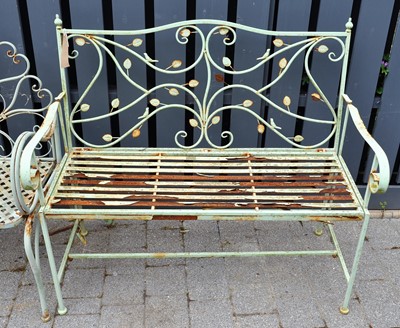 Lot 1184 - A green painted tubular metal two-seater...