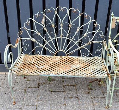 Lot 1185 - A green painted tubular metal floral design...