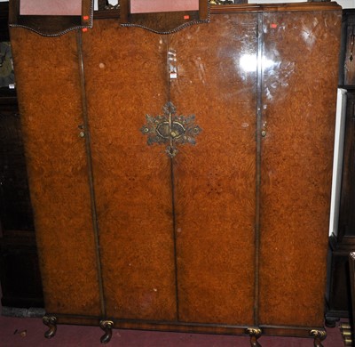 Lot 1216 - A 1930s figured walnut four-door wardrobe,...
