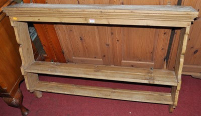 Lot 1234 - A rustic pine two-tier wall mounted plate rack,...