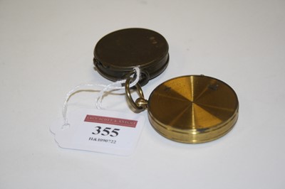 Lot 355 - Two vintage brass cased pocket compasses, the...