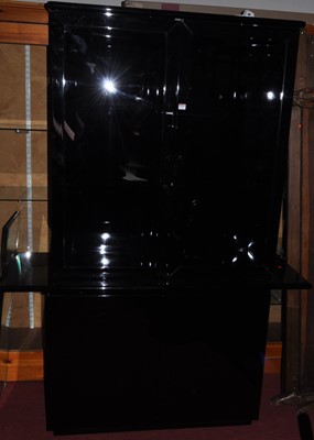 Lot 1238 - A contemporary black lacquered four door side...