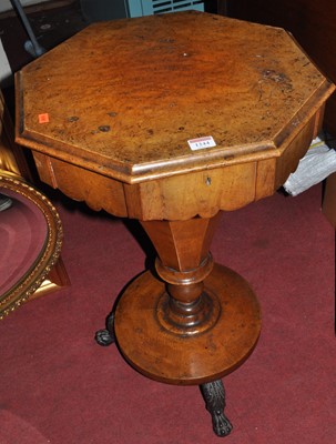 Lot 1244 - A mid-Victorian figured walnut octagonal hinge-...