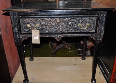 Lot 1246 - A 19th century ebonised floral relief carved...