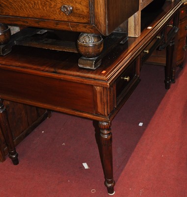 Lot 1268 - A contemporary hardwood three drawer writing...