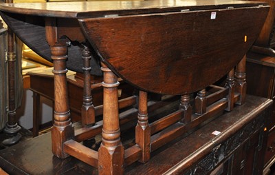 Lot 1270 - A contemporary joined oak dropleaf gateleg...