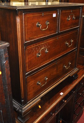 Lot 1274 - A mahogany low squarefront chest of two short...