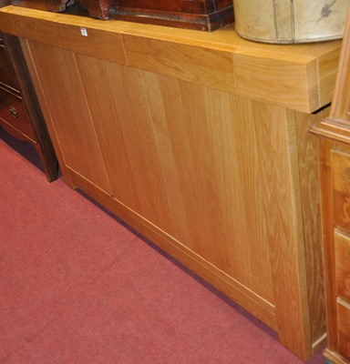 Lot 1280 - A contemporary light oak three door sideboard,...