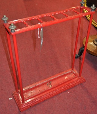 Lot 1294 - A Victorian red painted wrought iron and brass...