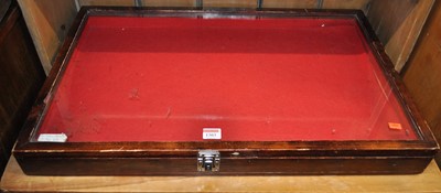 Lot 1303 - A stained wood and glazed top hinge table-top...