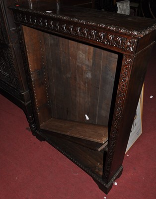 Lot 1316 - A circa 1900 floral relief carved oak low...