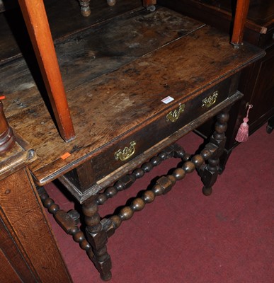 Lot 1326 - An antique joined oak plank topped single...