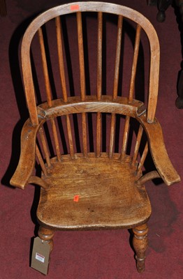 Lot 1331 - A 19th century child's elm and beech stickback...