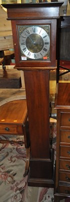 Lot 1355 - A mahogany grand-daughter clock, having a...