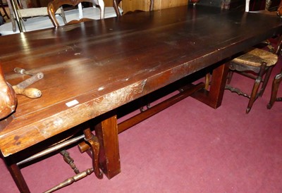 Lot 1373 - An Eastern stained hardwood rectangular dining...