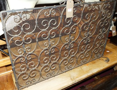 Lot 1384 - A wrought iron and mesh inset spark guard,...